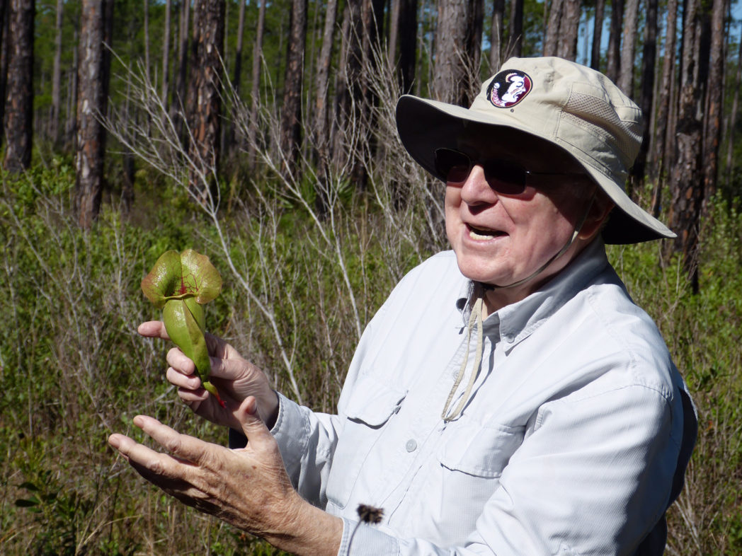 Dr. Anderson holds up a pitcherplant
