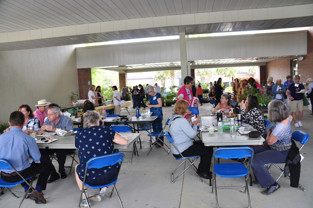 people eating lunch and sorting compostable and landfill waste