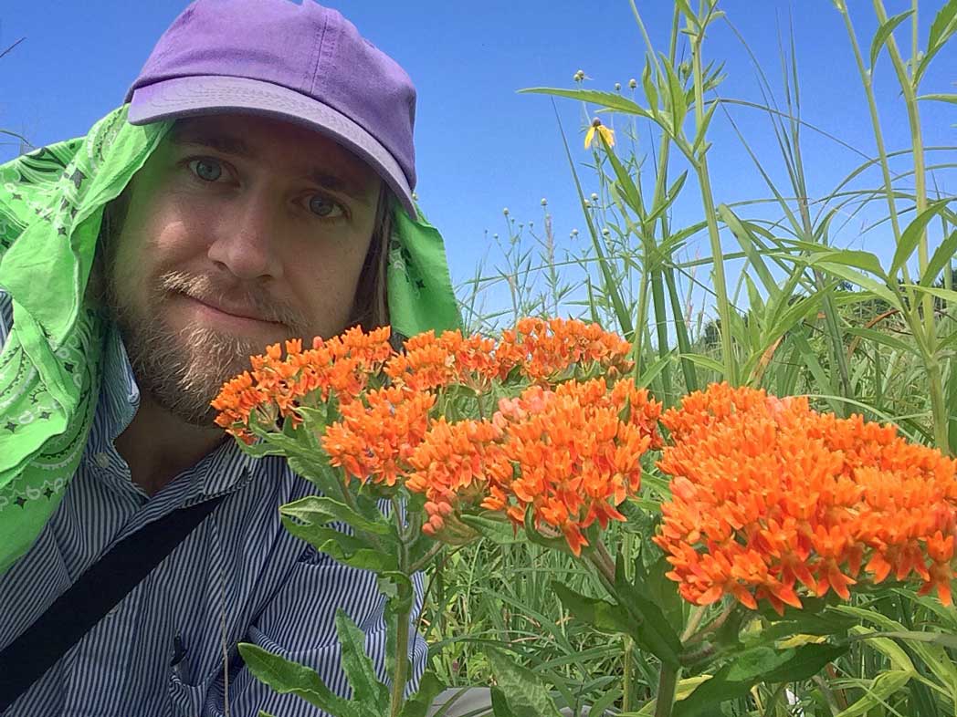 Nash Turley with orange milkweed flowers