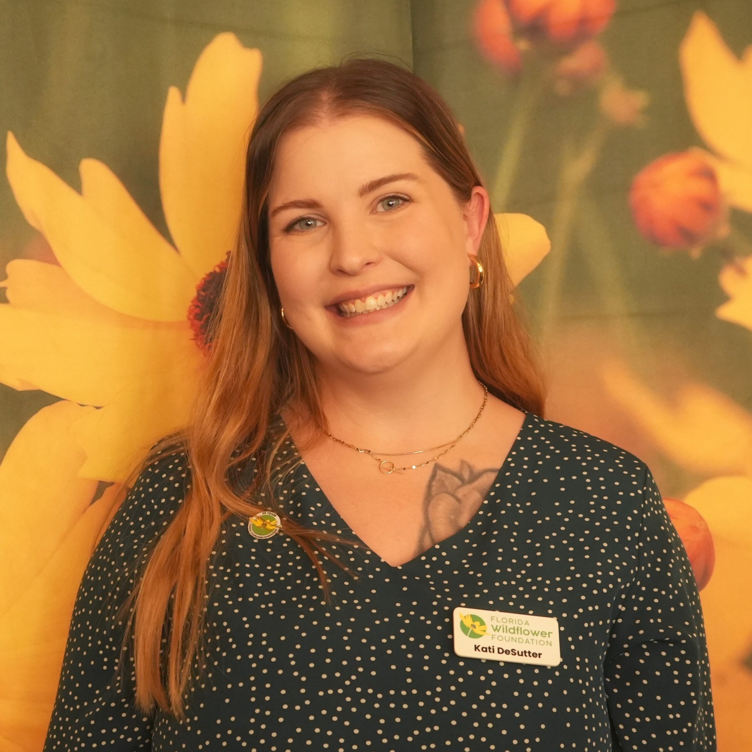 Kati DeSutter in front of Coreopsis background.
